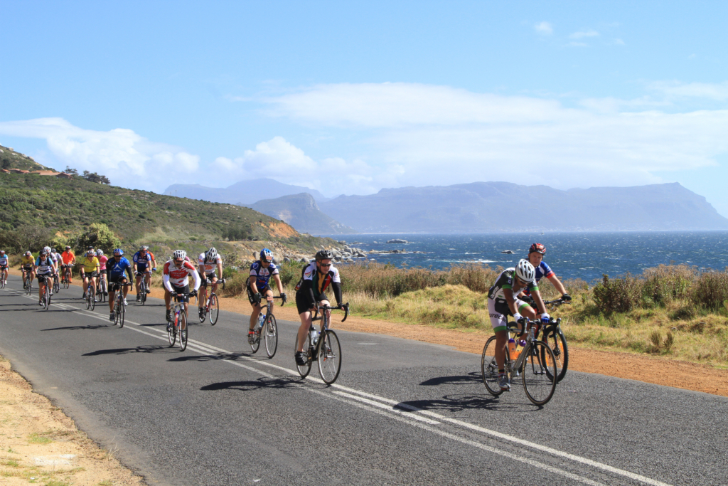 Cyclists riding along the road