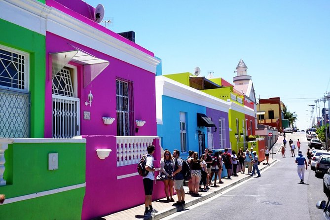 Tourists standing at the colorful houses in Cape Town South Africa