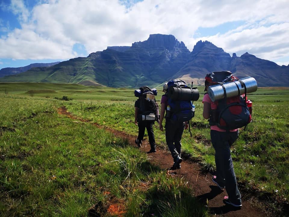 A group trekking thru the mountains